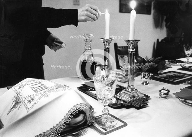 Lighting Shabbat candles, 1985. Creator: Unknown.