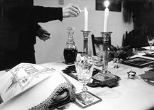Lighting Shabbat candles, 1985. Creator: Unknown