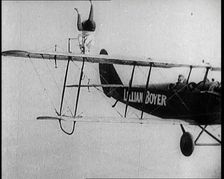 Lilian Boyer Performing Acrobatic Feats from a Flying Biplane, 1922. Creator: British Pathe Ltd