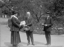 Lillian Cromlein receiving seed from Tumulty, National Emergency War Garden Comm., 1917. Creator: Harris & Ewing