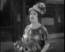 Lily Morris Performing Why Am I Always a Bridesmaid? on a Stage Made to Look Like a..., 1920. Creator: British Pathe Ltd