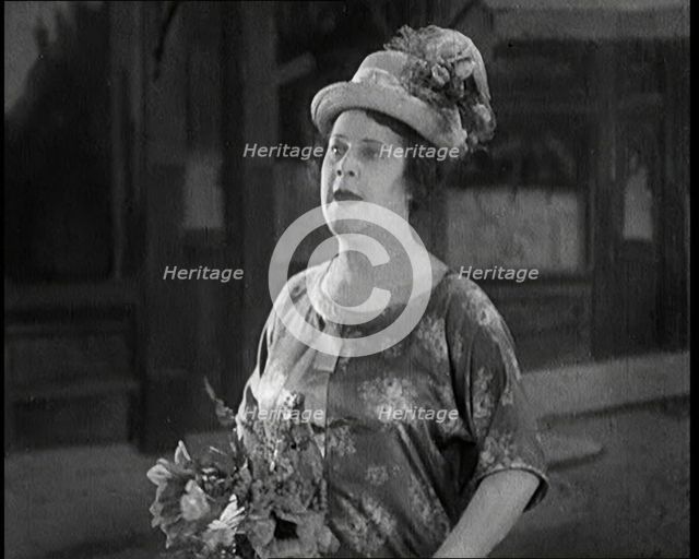 Lily Morris Performing 'Why Am I Always a Bridesmaid?' on a Stage Made to Look Like a..., 1920. Creator: British Pathe Ltd.