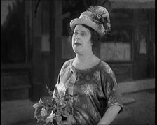 Lily Morris Performing Why Am I Always a Bridesmaid? on a Stage Made to Look Like a..., 1920. Creator: British Pathe Ltd