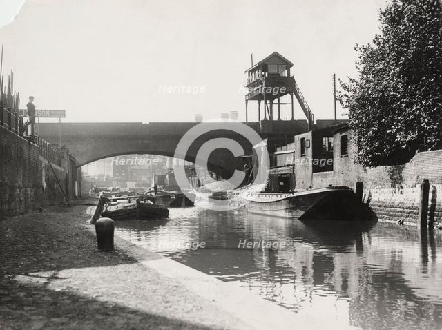 Limehouse Cut looking south from Commercial Road, Stepney, London, c1925. Artist: Unknown