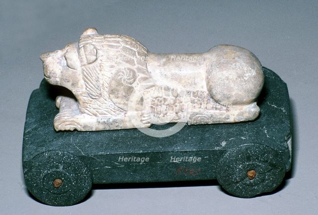 Limestone and bitumen lion mounted on a wheeled base, Susa, c12th century BC. Artist: Unknown