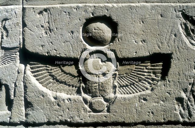 Limestone relief of a scarab beetle and vulture wings under a disk of the sun, Edfu, Egypt. Artist: Unknown