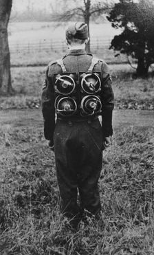 Limpet mines being carried on a harness on the back of a soldier, c1943. Creator: British Government