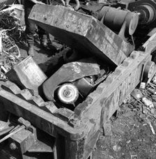 Linderman box baler crushing scrap, Rotherham, South Yorkshire, 1963. Creator: Michael Walters