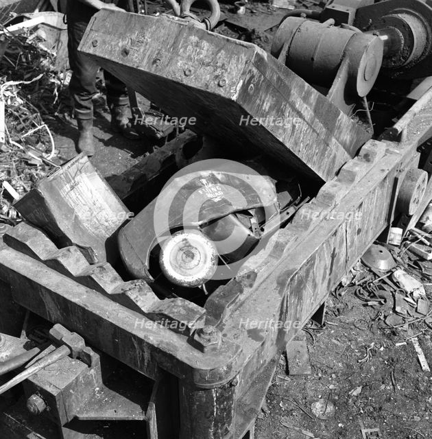 Linderman box baler crushing scrap, Rotherham, South Yorkshire, 1963.  Creator: Michael Walters.