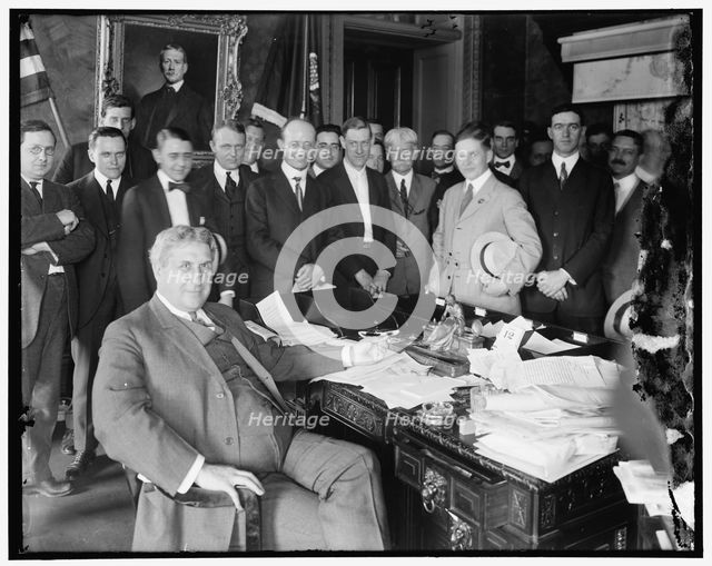 Lindley M. Garrison in office with group, between 1910 and 1920. Creator: Harris & Ewing.