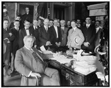 Lindley M. Garrison in office with group, between 1910 and 1920. Creator: Harris & Ewing
