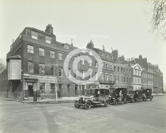 Line of taxis, Abingdon Street, Westminster, London, 1933. Artist: Unknown.