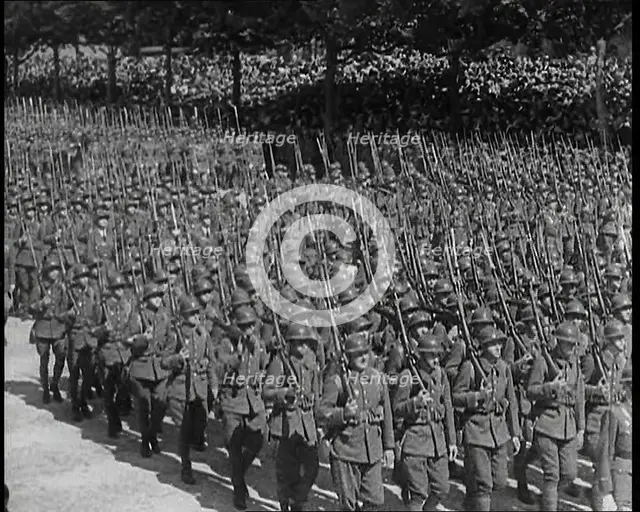 Lines of Male French Soldiers Marching Down the Champs Elysees During a Bastille Day..., 1939. Creator: British Pathe Ltd.