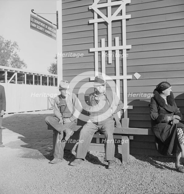 Lineup outside of Farm Security Administration grant office early in the morning, Tulare, CA, 1938. Creator: Dorothea Lange.