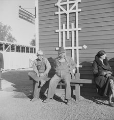 Lineup outside of Farm Security Administration grant office early in the morning, Tulare, CA, 1938. Creator: Dorothea Lange