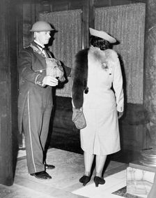 Linkman at the Trocadero wearing a tin hat, Westminster, London, October 1940. Creator: Unknown