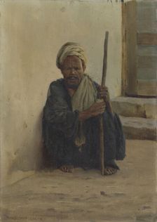 Luxor, Arab holding a stick sitting in a street, 1892. Creator: Henry Brokman