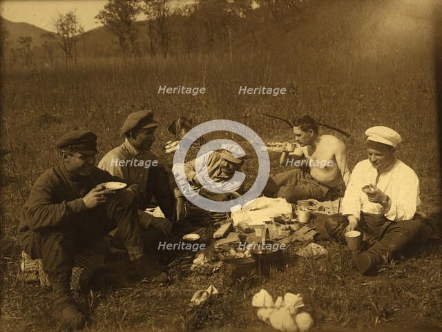 Lunch at the halt. Group portrait, 1920-1929. Creator: Unknown.