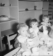 Lunchtime for young migrants at Shafter Camp, California, 1939. Creator: Dorothea Lange