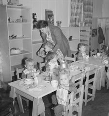 Lunchtime for young migrants at Shafter Camp, California, 1939. Creator: Dorothea Lange