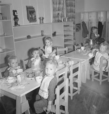 Lunchtime for young migrants at Shafter Camp, California, 1939. Creator: Dorothea Lange