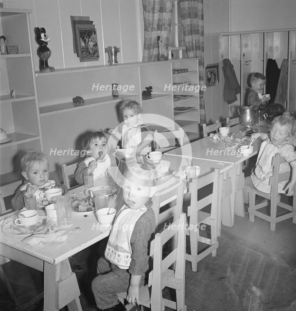 Lunchtime for young migrants at Shafter Camp, California, 1939. Creator: Dorothea Lange.