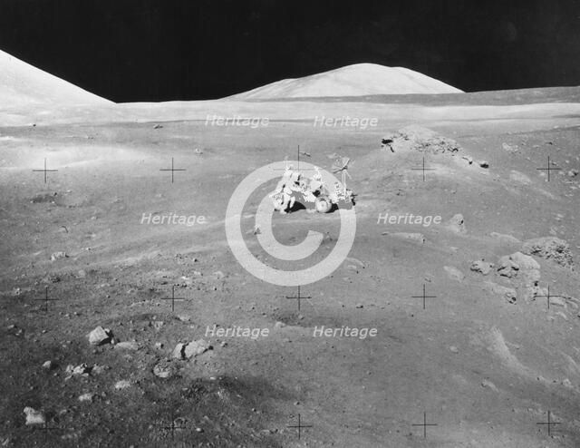 Lunarscape of Station 4, showing Harrison Schmitt at the lunar roving vehicle, 1972.  Creator: Unknown.