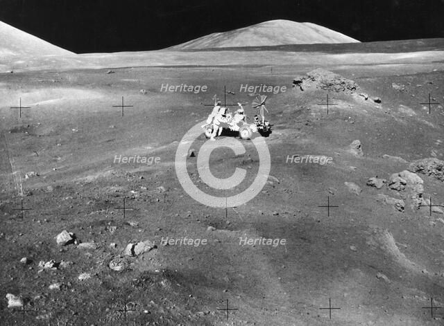 Lunarscape of Station 4, showing Harrison Schmitt at the lunar roving vehicle, 1972.  Creator: Unknown.