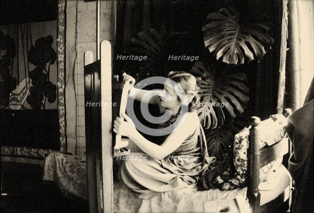 Lydia Delectorskaya preparing a canvas in Matisse’s studio, Place Charles-Félix, Nice, 1936. Creator: Matisse, Henri (1869-1954).