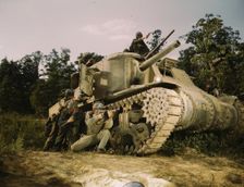 M-3 tank and crew using small arms, Ft. Knox, Ky., 1942. Creator: Alfred T Palmer