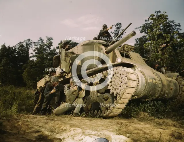M-3 tank and crew using small arms, Ft. Knox, Ky., 1942. Creator: Alfred T Palmer.