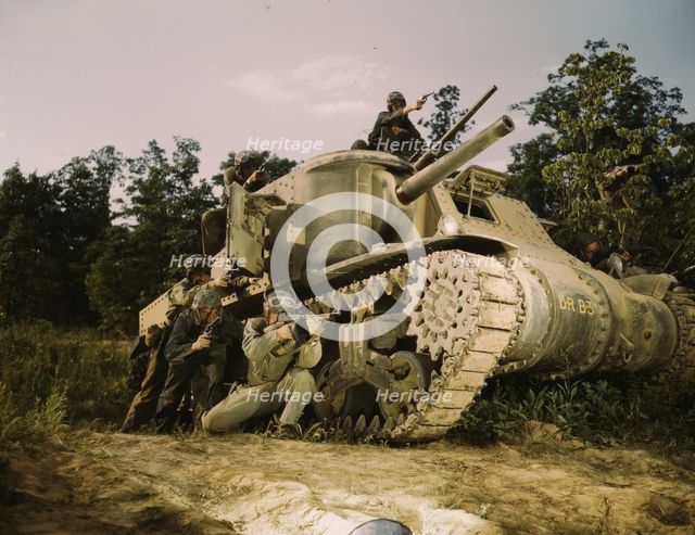 M-3 tank and crew using small arms, Ft. Knox, Ky., 1942. Creator: Alfred T Palmer.