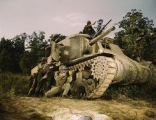 M-3 tank and crew using small arms, Ft. Knox, Ky., 1942. Creator: Alfred T Palmer