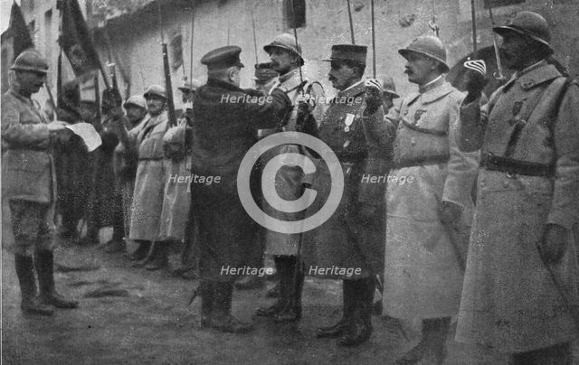 'M. Poincare a Verdun; decoration du commandant Nicolai, chef du bataillon qui est rentre le..., 191 Creator: Unknown.