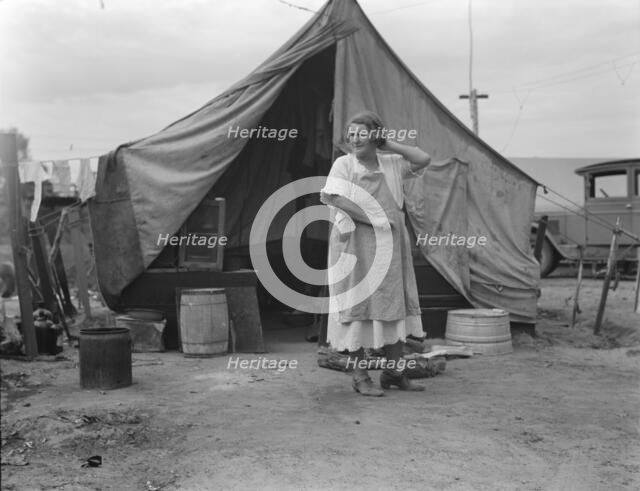 Mother of family of migrant fruit workers encamped on outskirts of Porterville, California, 1936. Creator: Dorothea Lange.