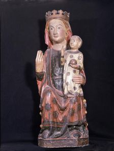 Mother of God polychromed wood sculpture. Virgin seated, with his right hand raised while hol…