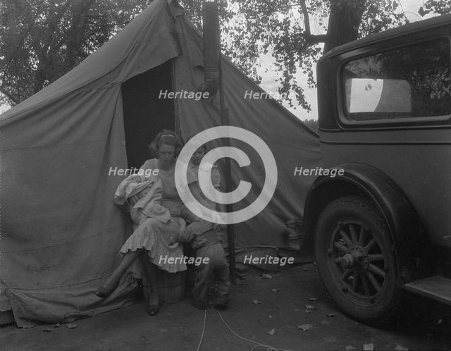 Mother and three children in a California squatter camp, 1936. Creator: Dorothea Lange.