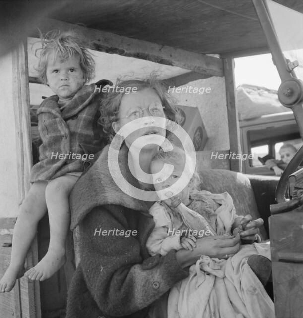 Mother and two children on the road, Tulelake, Siskiyou County, California, 1939. Creator: Dorothea Lange.