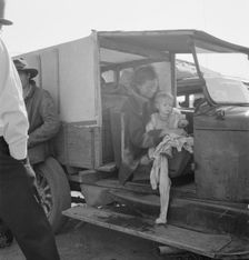 Mother and baby of family on the road, Tulelake, Siskiyou County, California, 1939. Creator: Dorothea Lange