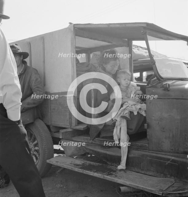 Mother and baby of family on the road, Tulelake, Siskiyou County, California, 1939. Creator: Dorothea Lange.