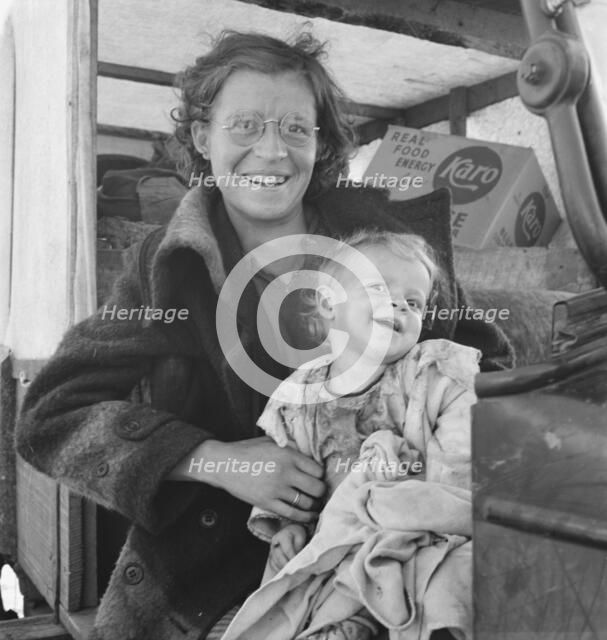 Mother and baby of family on the road, Tulelake, Siskiyou County, California, 1939. Creator: Dorothea Lange.