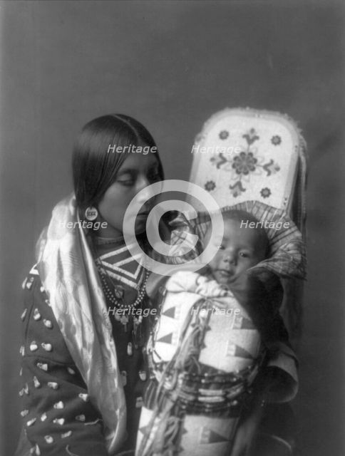 Mother and child-Apsaroke, c1908. Creator: Edward Sheriff Curtis.