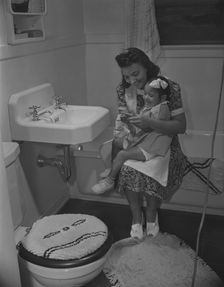 Mother and her daughter, Frederick Douglass housing project, Anacostia, D.C., 1942. Creator: Gordon Parks
