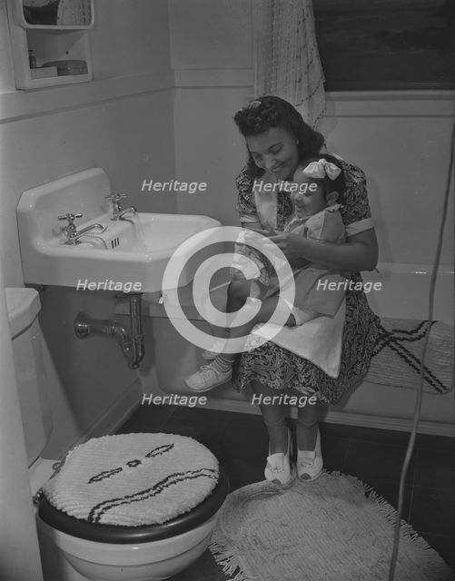 Mother and her daughter, Frederick Douglass housing project, Anacostia, D.C., 1942. Creator: Gordon Parks.