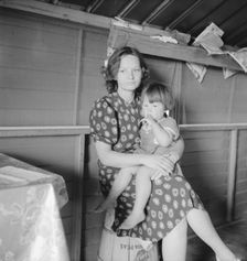 Mother with sick baby awaits arrival of FSA camp resident nurse, FSA camp, Tulare County, CA, 1939. Creator: Dorothea Lange