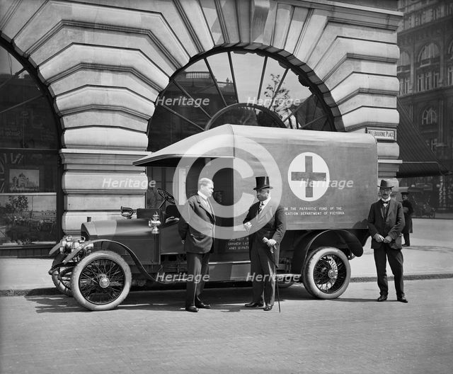 Motor ambulance on the Strand, Westminster, London, May 1915. Artist: H Bedford Lemere.