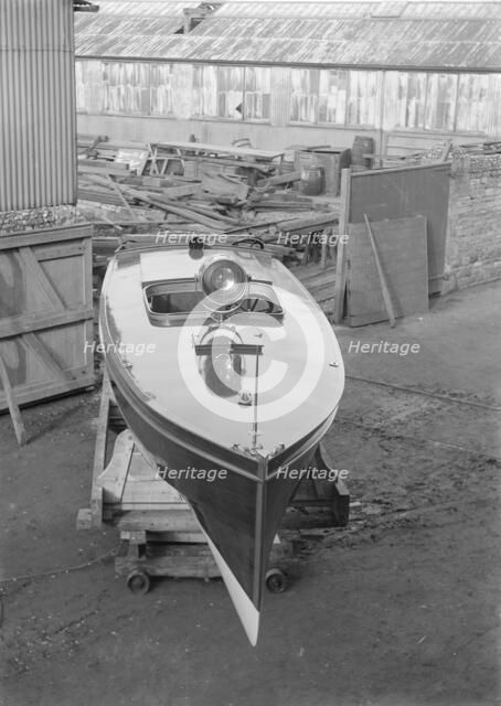 Motor launch in boatyard, 1913. Creator: Kirk & Sons of Cowes.