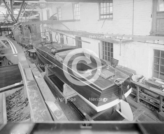 Motor launch in boatyard shed, 1913. Creator: Kirk & Sons of Cowes.