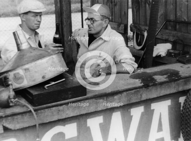 Motor racing mechanics, 1953. Artist: Unknown