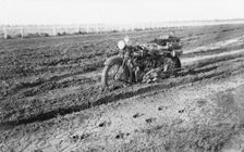 Motorbike in mud, near Dalby, Queensland, 1930. Creator: Jack Bain